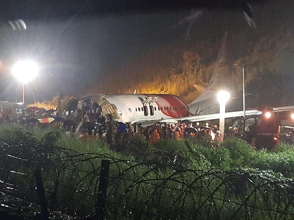 The wreckage of an Air India Express flight after it skidded off a runway Friday night at Kozhikode International Airport in the Indian state of Kerala.