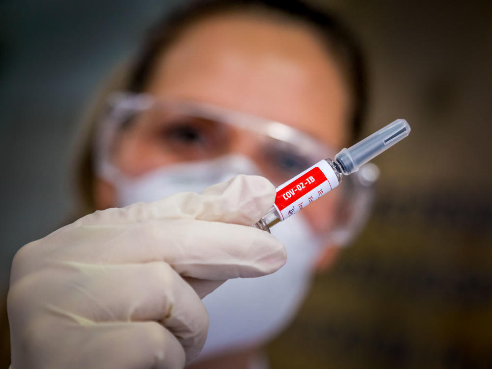 A nurse holds a COVID-19 vaccine candidate produced by Chinese company Sinovac Biotech at the São Lucas Hospital in Porto Alegre, Brazil, on Aug. 8.