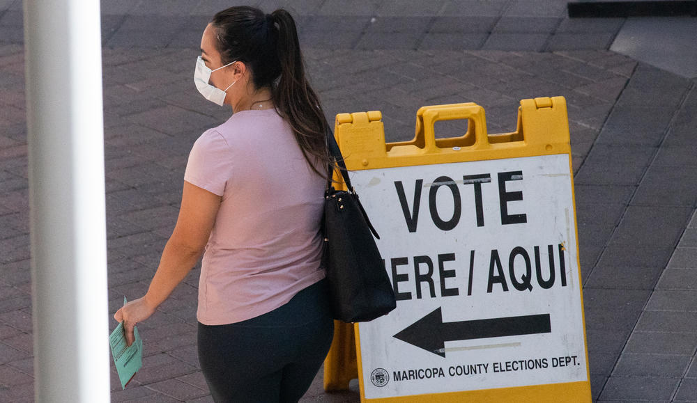 A voter waits to cast their ballot during Arizona's primary election on Aug. 4 in Phoenix.