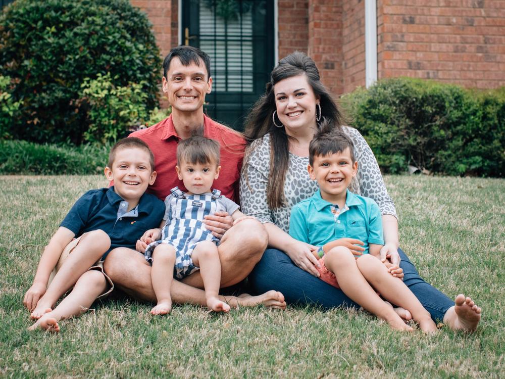 Natalie Nowell with her husband and three children. She's been suffering from COVID-19 symptoms for months and still has trouble breathing.