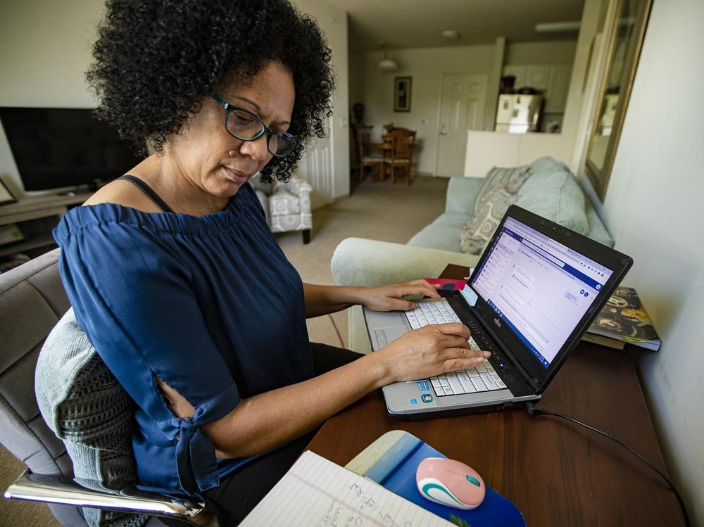 Care resource coordinator Luisa Schaeffer scrolls through her COVID-19 isolation case list for the day: One woman is out of milk, while another needs help finding a doctor and making an appointment. A man also asks about getting help to pay rent.