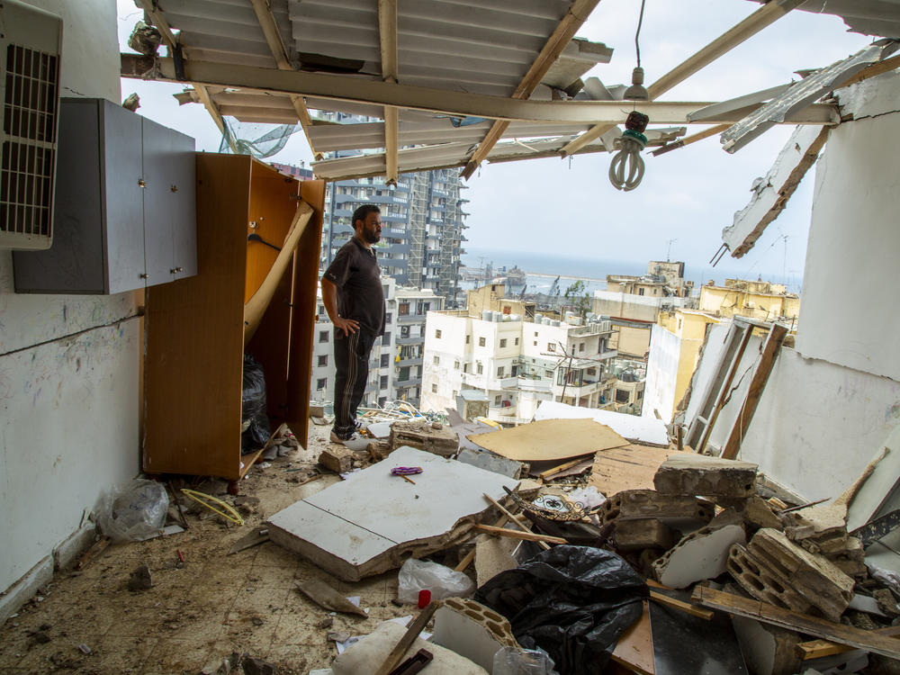 Habeb al-Hamad Azab, a Syrian refugee, stands in front of his destroyed home in Beirut's Mar Mikhael neighborhood.