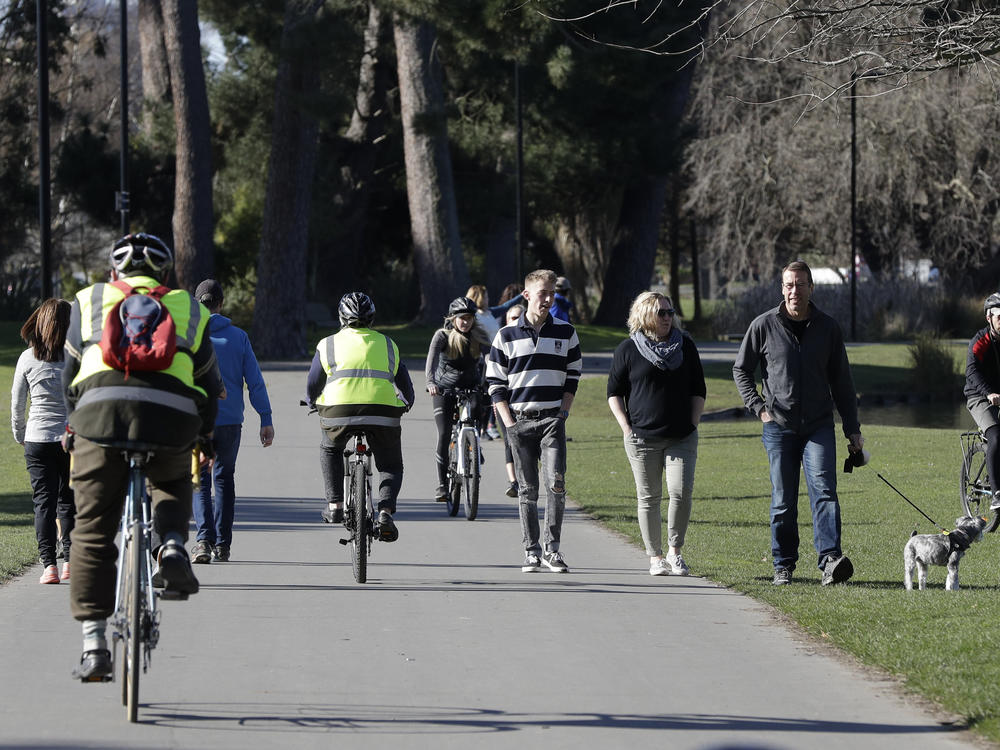 Residents exercise Sunday at Hagley Park in Christchurch, New Zealand. The country's border remains closed to foreign nationals, and New Zealanders returning home are forced to follow a strict 14-day quarantine.