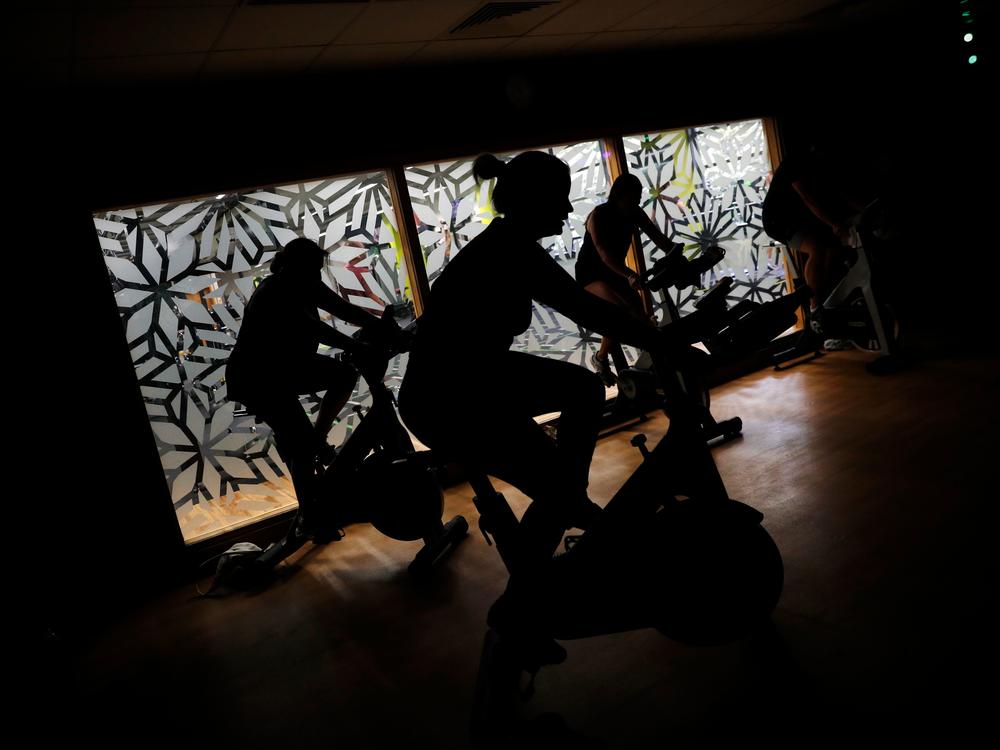 People are working out in the shadows.