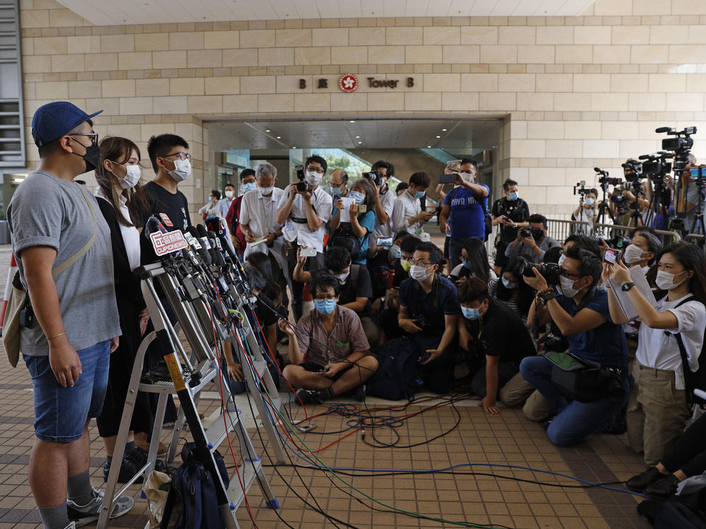 Pro-democracy activists (from left) Ivan Lam, Agnes Chow and Joshua Wong arrive at a Hong Kong court last week for sentencing after Chow pleaded guilty to inciting others to participate in an unlawful assembly, as well as to participating in an unauthorized assembly, related to protests in June 2019.