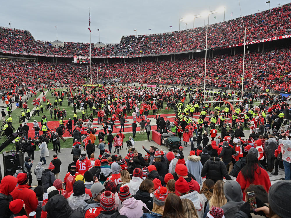Fans rush the field after the Ohio State Buckeyes defeat the Penn State Nittany Lions 28-17 in November in Columbus, Ohio. The Big Ten and PAC-12 have put fall sports on hold due to the pandemic.