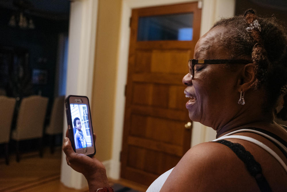 Raymonde Elian talks with her grandson by video call on her day off in May 2020.