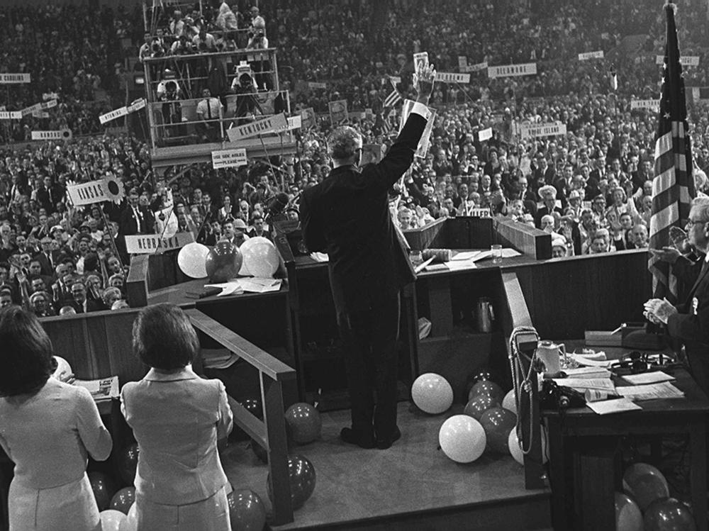 On July 16, 1964, Barry Goldwater waves to delegates inside the Cow Palace at the Republican National Convention in San Francisco. He claimed the GOP presidential nomination at a convention soured with party divisions, all aired on television.