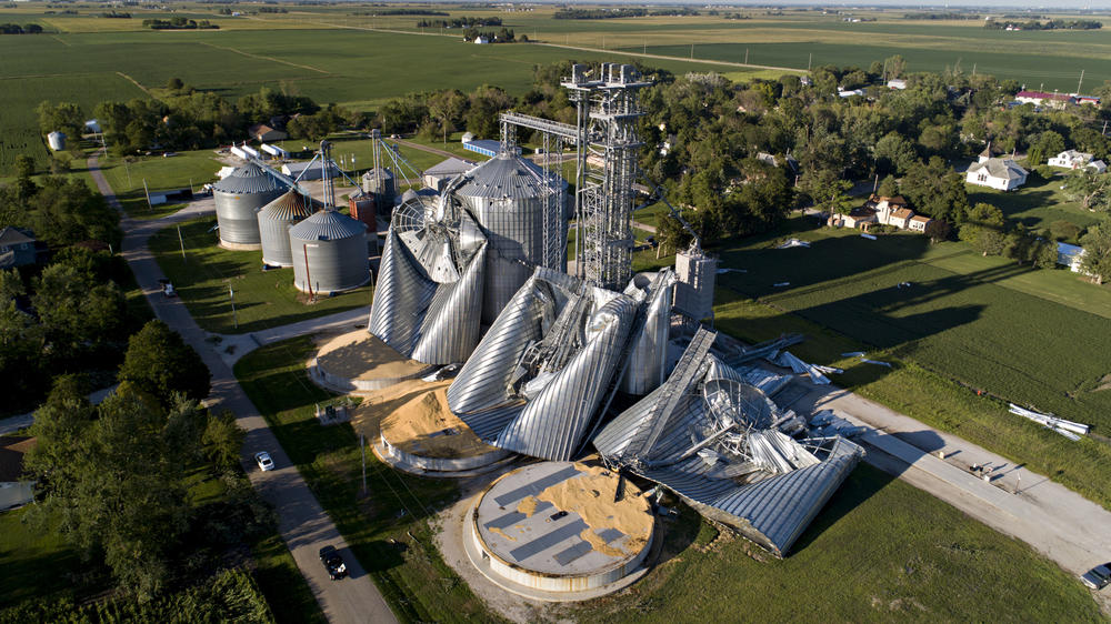 In this aerial image from a drone, damaged grain bins are shown at the Heartland Co-Op grain elevator in Luther, Iowa, on Tuesday.