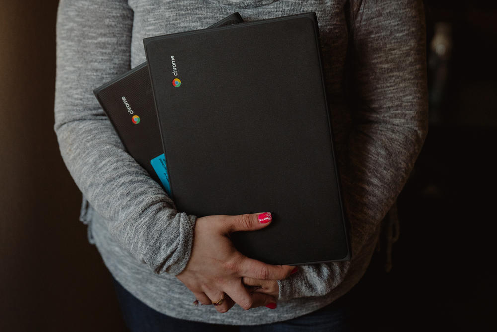 Patricia Lopez, a mother of two, enrolled in community college after losing her job at the start of the pandemic. Because she did not have a computer, the school gave her one. Her daughter, Yamely, also received a Chromebook from school.