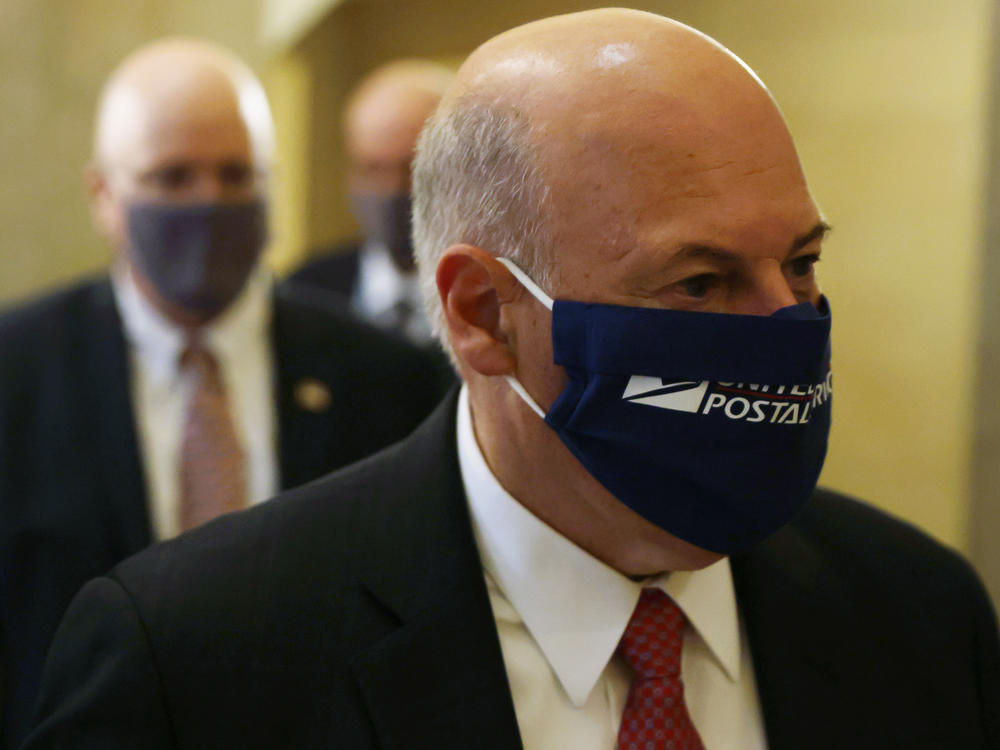 Postmaster General Louis DeJoy is under fire for management changes he has made to the Postal Service that some say could slow the delivery of absentee ballots this fall.