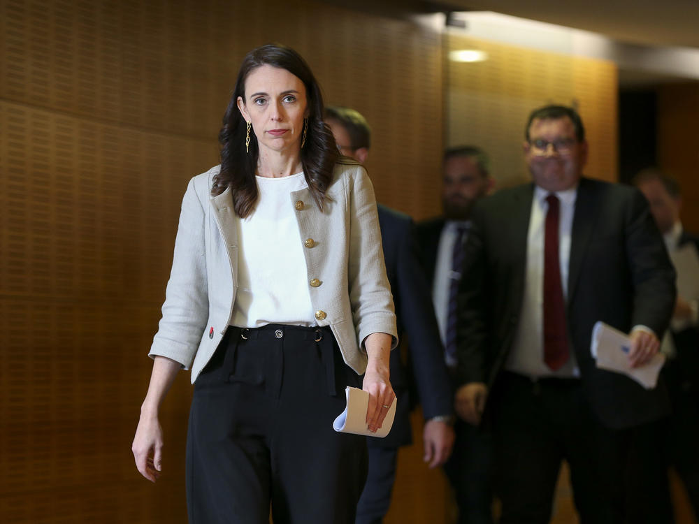 New Zealand Prime Minister Jacinda Ardern arrives for a press conference Friday in Wellington. A new coronavirus outbreak has grown to 30 cases, and Ardern predicts of the cluster, 