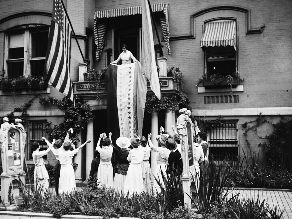 Alice Paul, a leader of the National Woman's Party, unfurls the ratification banner with its new 36th star after Tennessee ratified the 19th Amendment on Aug. 18, 1920. The amendment prohibits denying the right to vote based on sex.