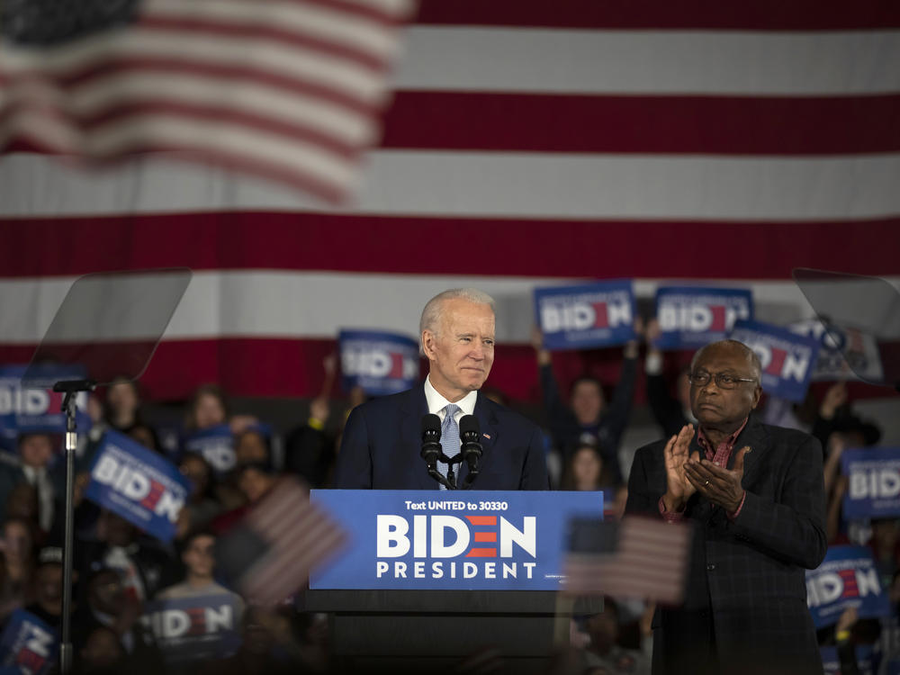 Joe Biden celebrates his win in the South Carolina primary on Feb. 29, 2020. An endorsement from Rep. James Clyburn (right) proved pivotal.