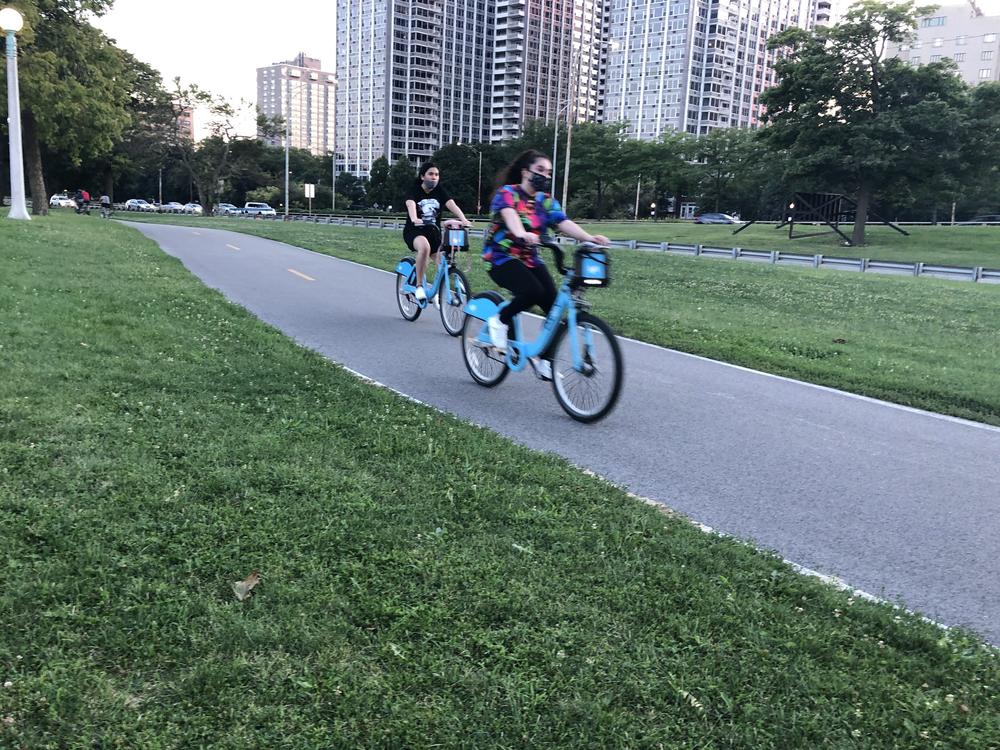 Cyclists enjoy a ride on Chicago's Lakefront Trail on a recent evening. Biking there and all across the country is up significantly during the pandemic.