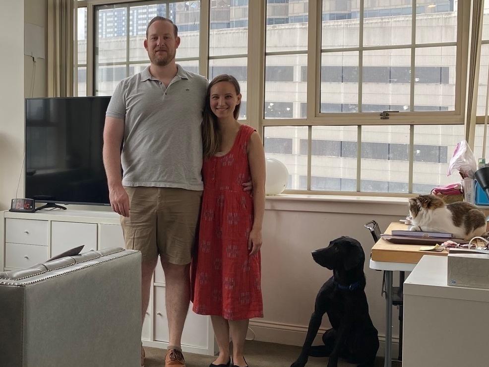 Lisa Vrooman with her boyfriend John Rock, dog Umar and cat Mochi. They love the high ceilings in their 650-square-foot apartment, but keeping it cool is costly.