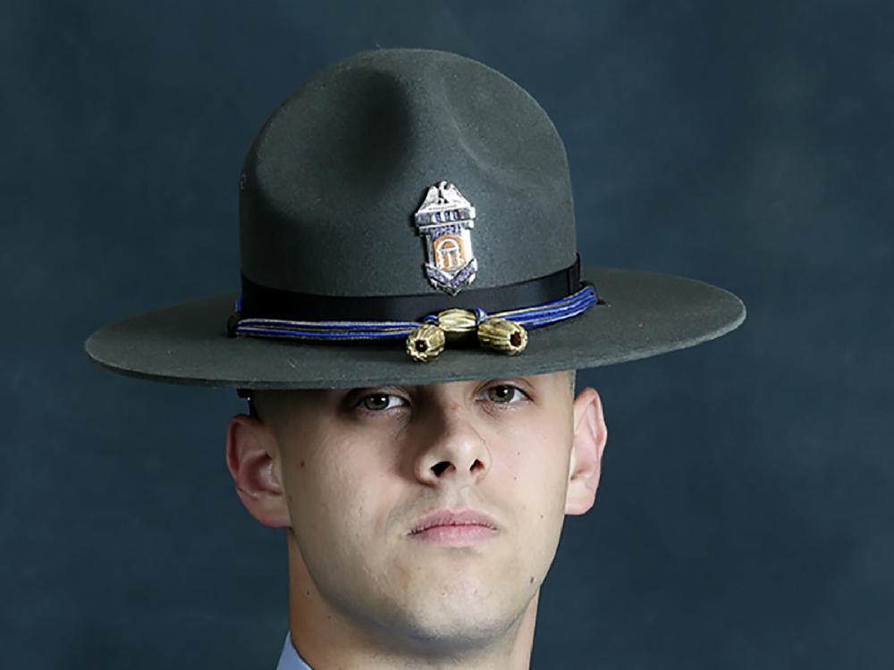 Former state Trooper Jacob Gordon Thompson has been charged with felony murder and aggravated assault in the killing of Julian Edward Roosevelt Lewis, a 60-year-old Black man.
