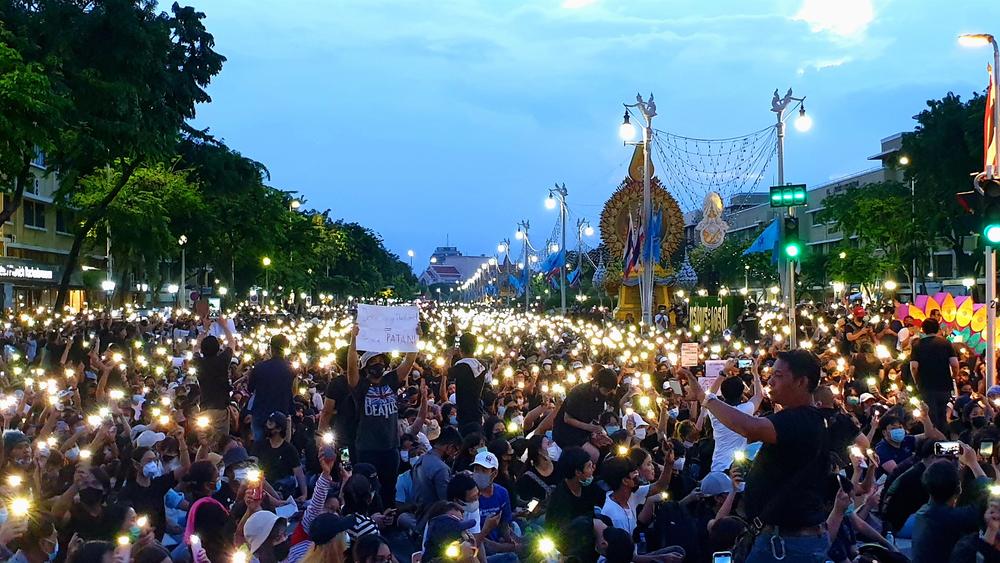 Lighted cellphones held up by demonstrators call for an end to the military-backed government on Sunday in Bangkok.