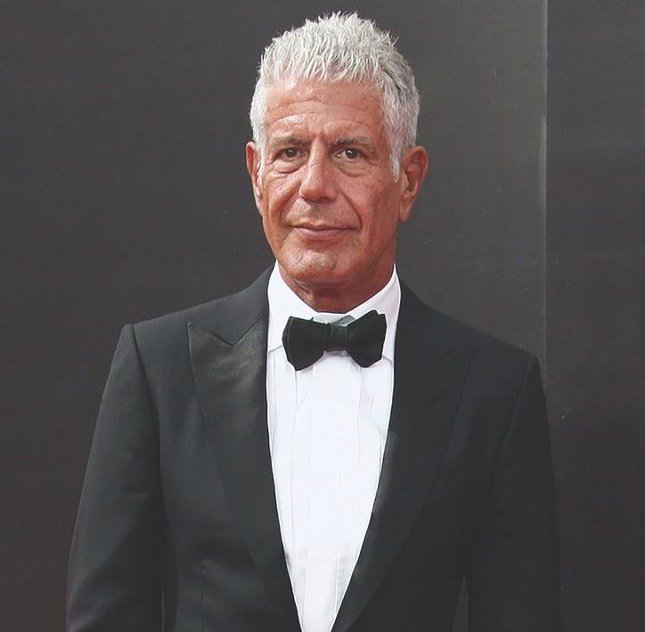 The auction features a variety of Anthony Bourdain's personal items. There are carved wooden figures, maps, furniture, books, watches, and even some of his early writings. You can also bid for some of Bourdain's clothing, like his cashmere scarves or his Tom Ford tuxedo, seen here.