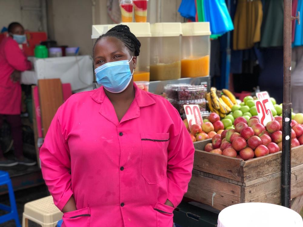 Monica Muthuma has been selling fruits, vegetables and dawa for five years at this stand. Since the pandemic began peaking in Kenya, she says, her ginger-infused drink has taken center stage at her store.