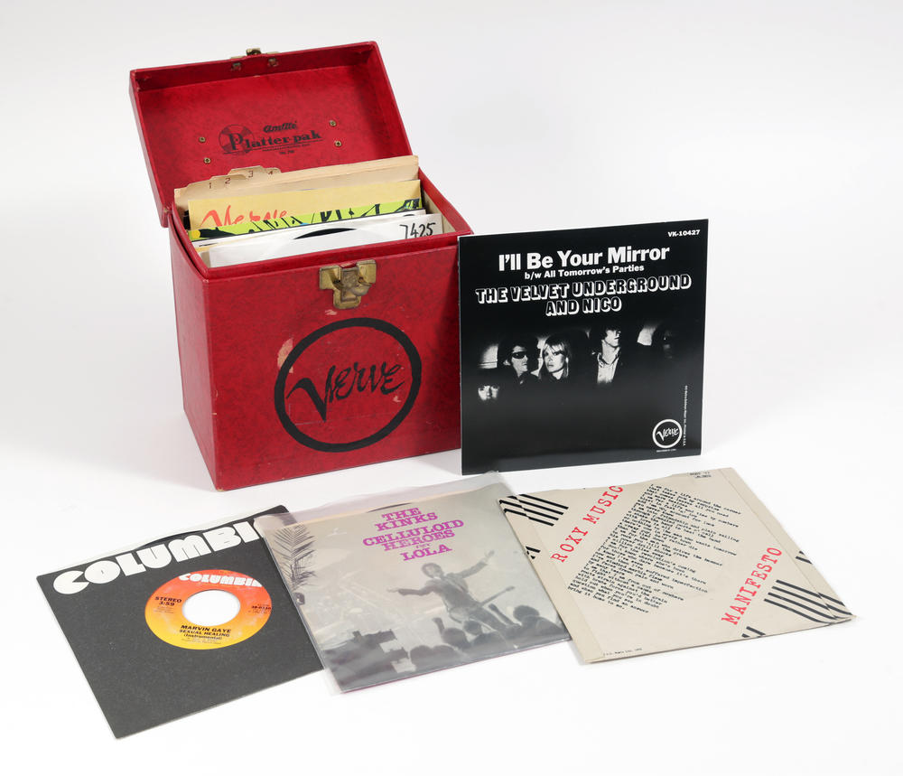 Another item up for auction: A small red Verve cardboard record case, containing 14 records (45's), from artists such as the Velvet Underground, Ella Fitzgerald, Marvin Gaye, Elvis Costello, and others.