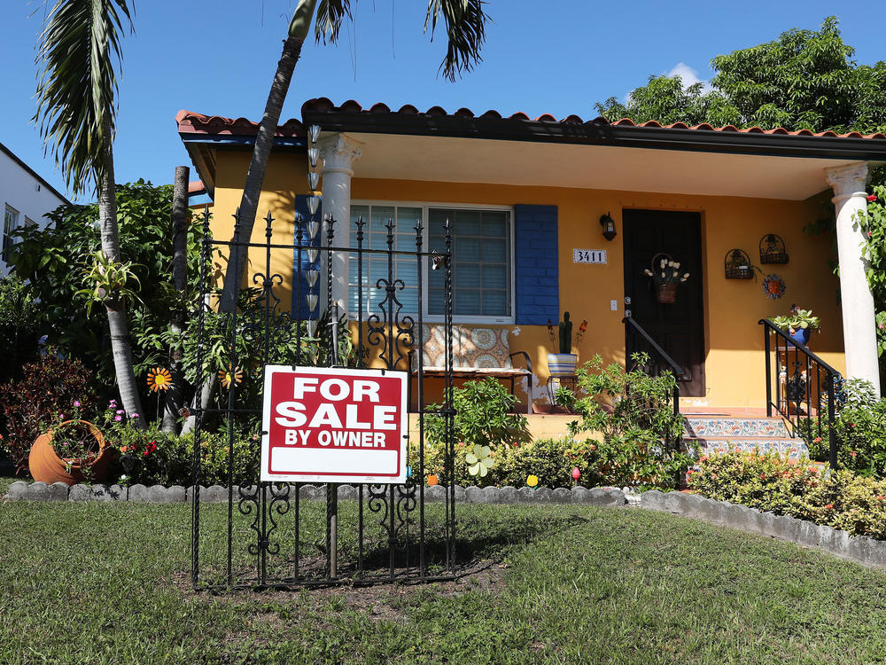 A sale sign is seen in front of a home in Miami. FHA loans are used by many minority, lower-income, and first-time homebuyers because the low down payments make homeownership more affordable. But this demographic is more likely to be hurt financially during the pandemic, and many FHA borrowers are skipping mortgage payments.