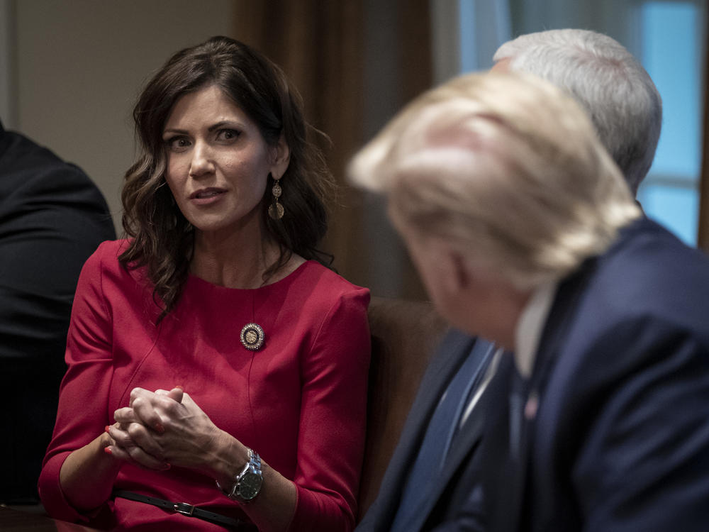 South Dakota Gov. Kristi Noem meets with President Trump and Vice President Pence at the White House in December. This month, she was one of the first governors to reject the president's offer of additional unemployment assistance.