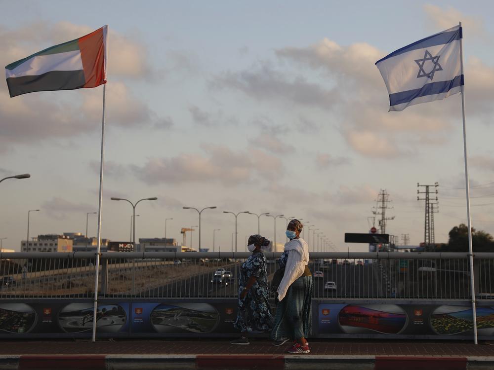 The flags of the United Arab Emirates and Israel are raised on the Peace Bridge in Netanya, Israel. The UAE flag was displayed to celebrate last week's announcement that the two countries have agreed to establish diplomatic relations.
