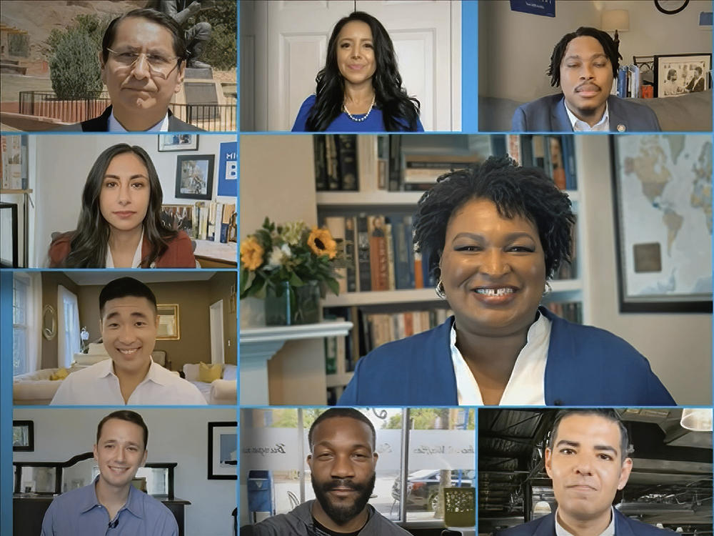 Former Georgia House Democratic leader Stacey Abrams (center) and 