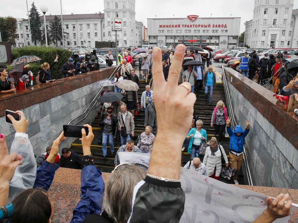 Protesters gather in front of the Minsk Tractor Works Plant to support workers leaving the plant after their work shift in Minsk, Belarus, on Wednesday.
