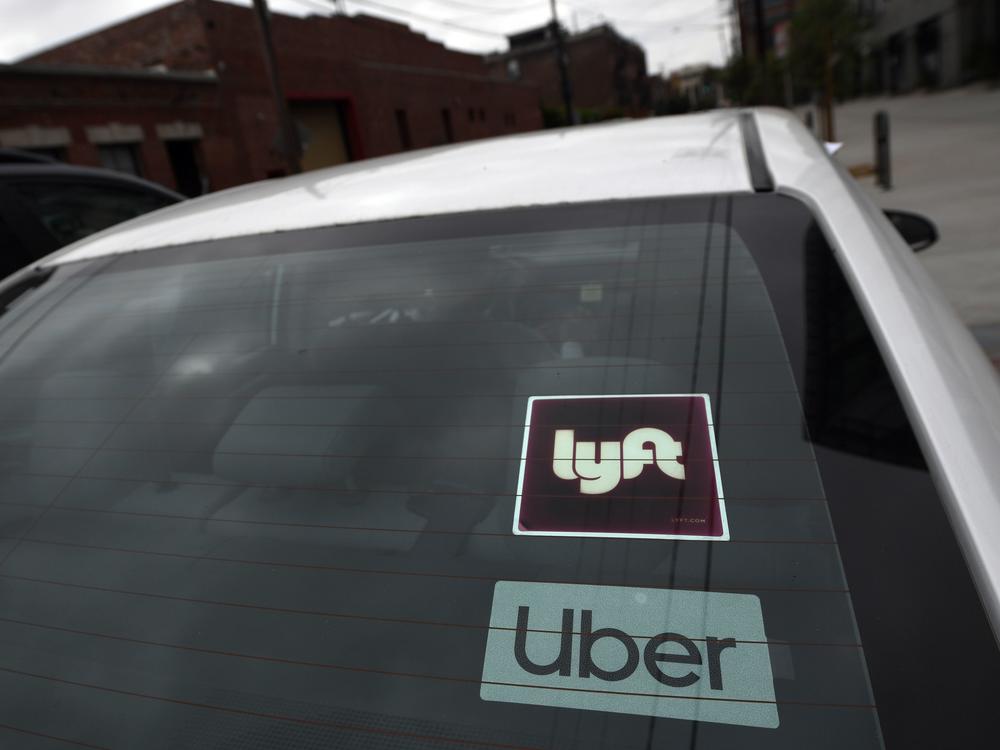 An appeals court has given Uber and Lyft more time to fight a judge's order over how they classify their drivers, averting a threatened shutdown in California.