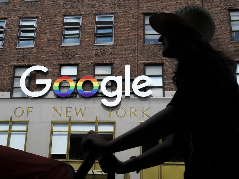 The Google logo adorns the outside of the company's New York City office building. The stock market is hitting records, in large part because of a handful of superstar tech stocks, including Alphabet, Google's parent company.