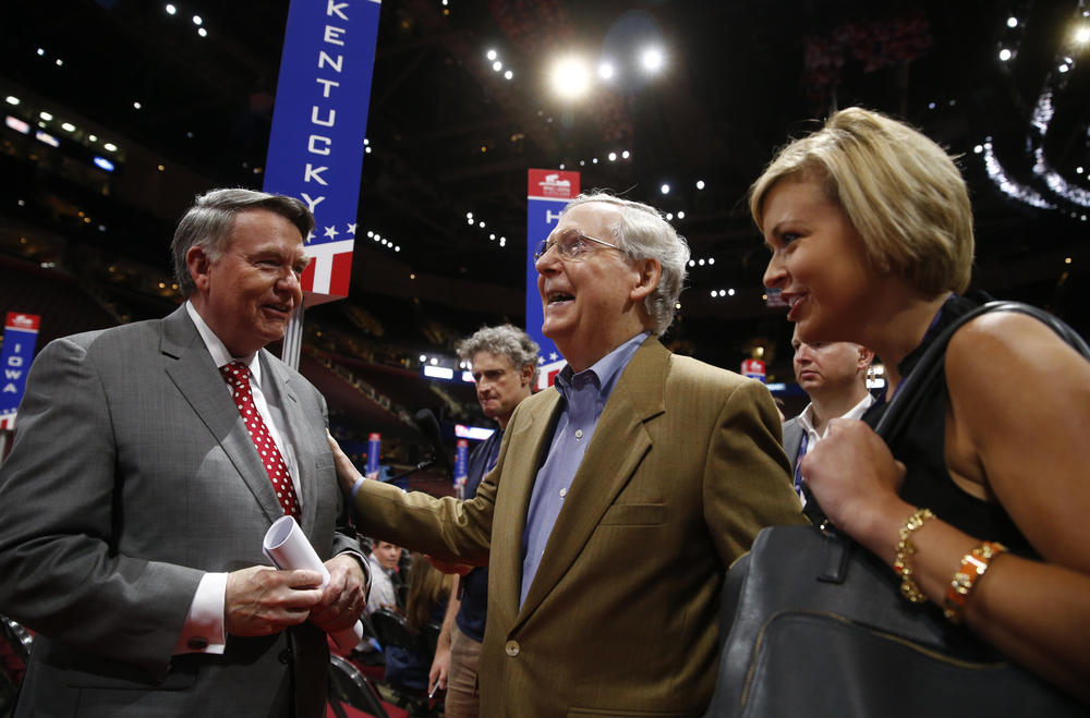 Senate Majority Leader Mitch McConnell, center, speaks with longtime ally Robert 