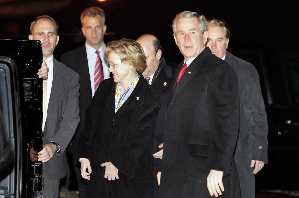 Then-President George W. Bush stands beside Aldona Wos upon arriving at the airport in Tallinn, Estonia, in November 2006. Wos, DeJoy's wife, was the U.S. ambassador to Estonia at that time.