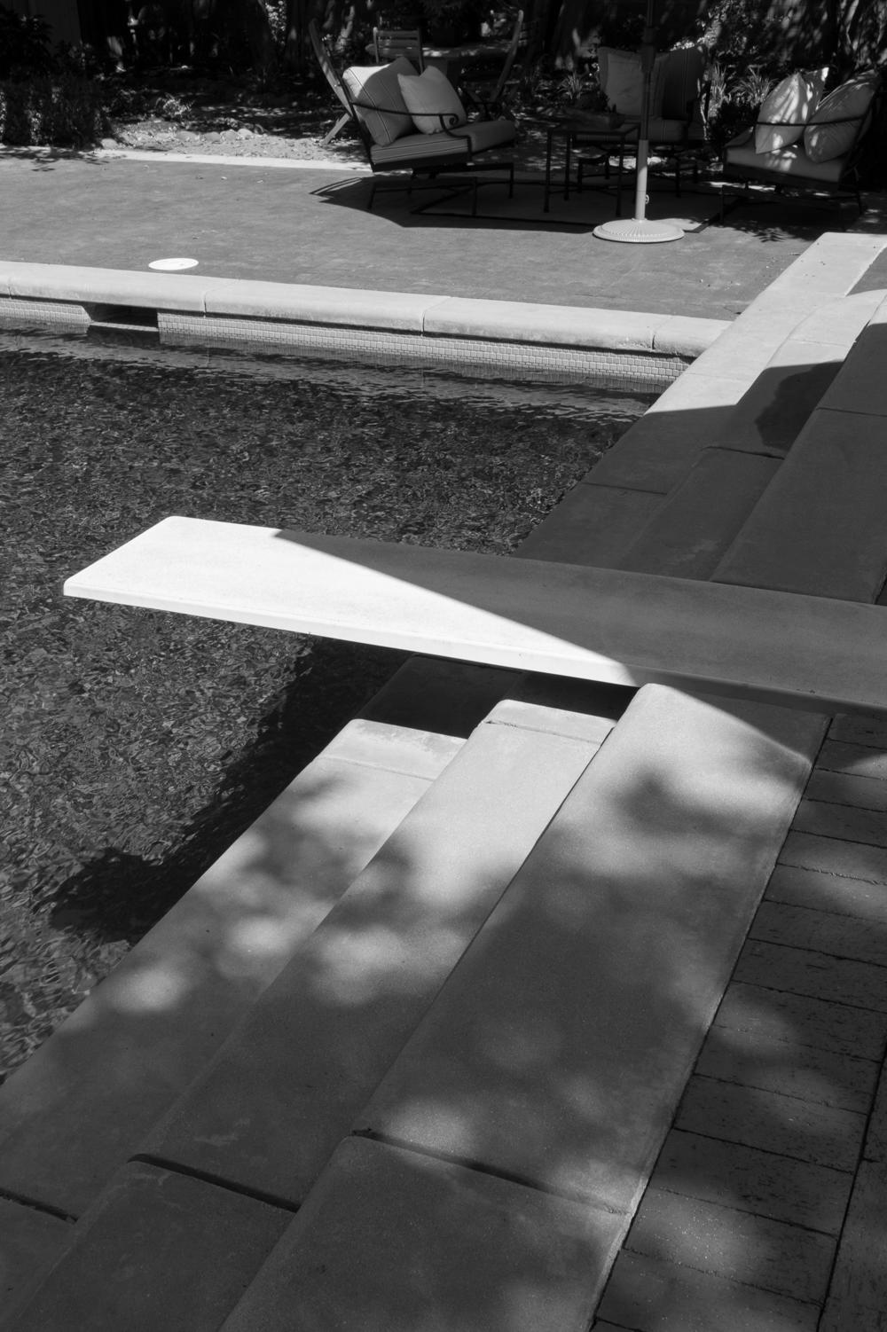 The swimming pool and diving board in the backyard of a home built for comedian Leon Errol in 1940 in LA's Toluca Lake neighborhood. The next owner was actor William Holden, who hosted the wedding reception for Ronald and Nancy Reagan there in 1952. Denzel Washington eventually lived in this home, though he has since relocated.