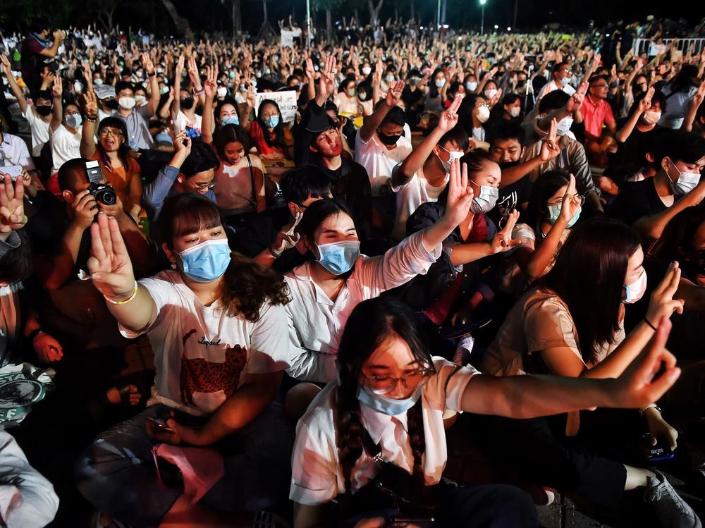 Protesters flash <em>The Hunger Games</em> salute during a pro-democracy rally at Thammasat University in Pathum Thani, north of Bangkok, earlier this month.
