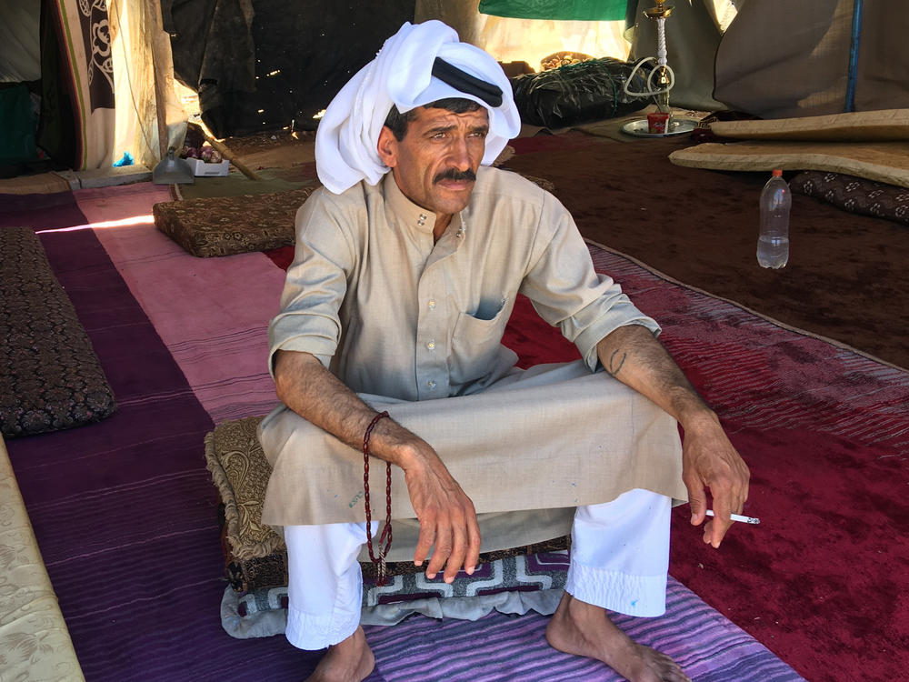 Syrian refugee Mohammad al-Saleh near Amman. He and his wife are farm laborers and were working in the fields when their tent caught fire in June, killing their four youngest children.