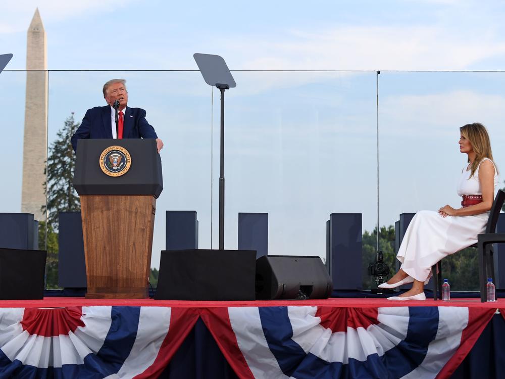 President Trump speaks on the South Lawn of the White House, accompanied by First Lady Melania Trump, on July 4. He'll deliver his main convention speech from the same location on Thursday.