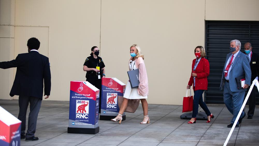 Republican National Convention delegates arrive at the Charlotte Convention Center on Sunday.