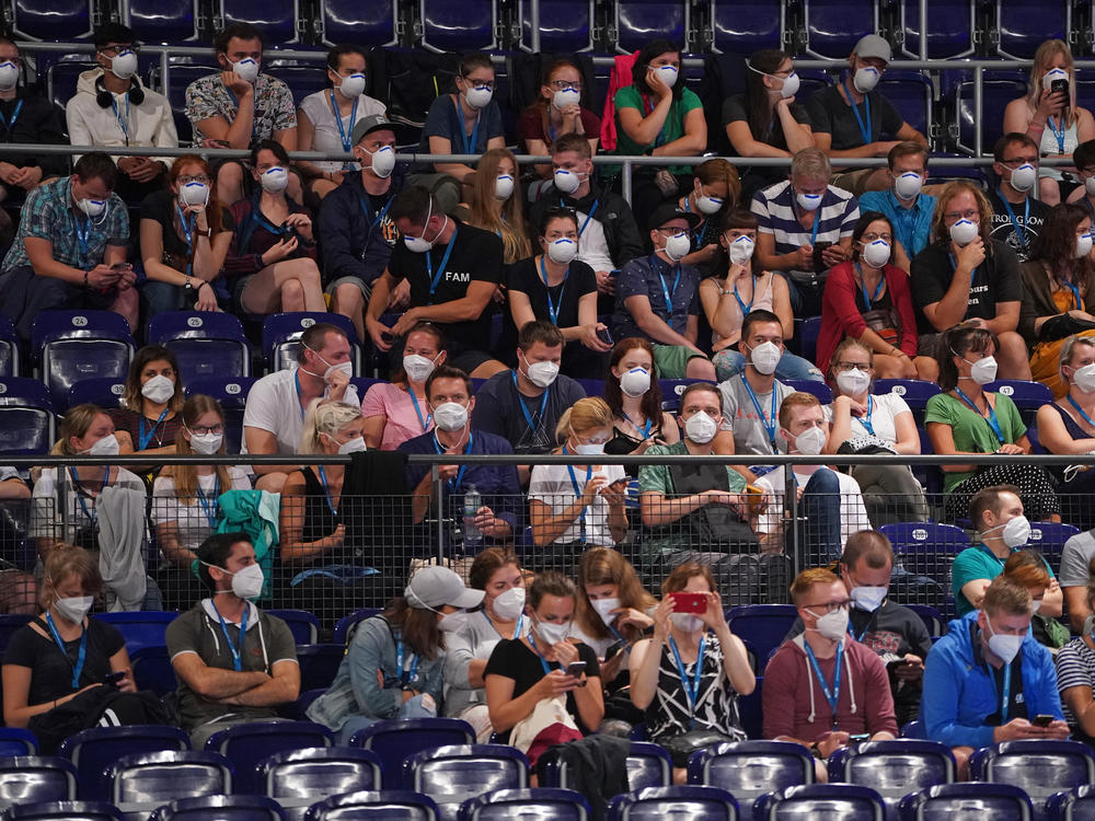 Participants wearing face masks in Leipzig, Germany, take part Saturday in a study to test how the coronavirus might spread in concert settings.