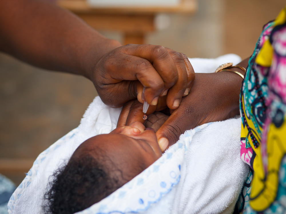 An oral polio vaccine, which contains weakened live virus, is administered in a health enter in Togo. Africa has declared that wild polio has been eradicated, but a relatively small number of cases of vaccine-derived polio persist.