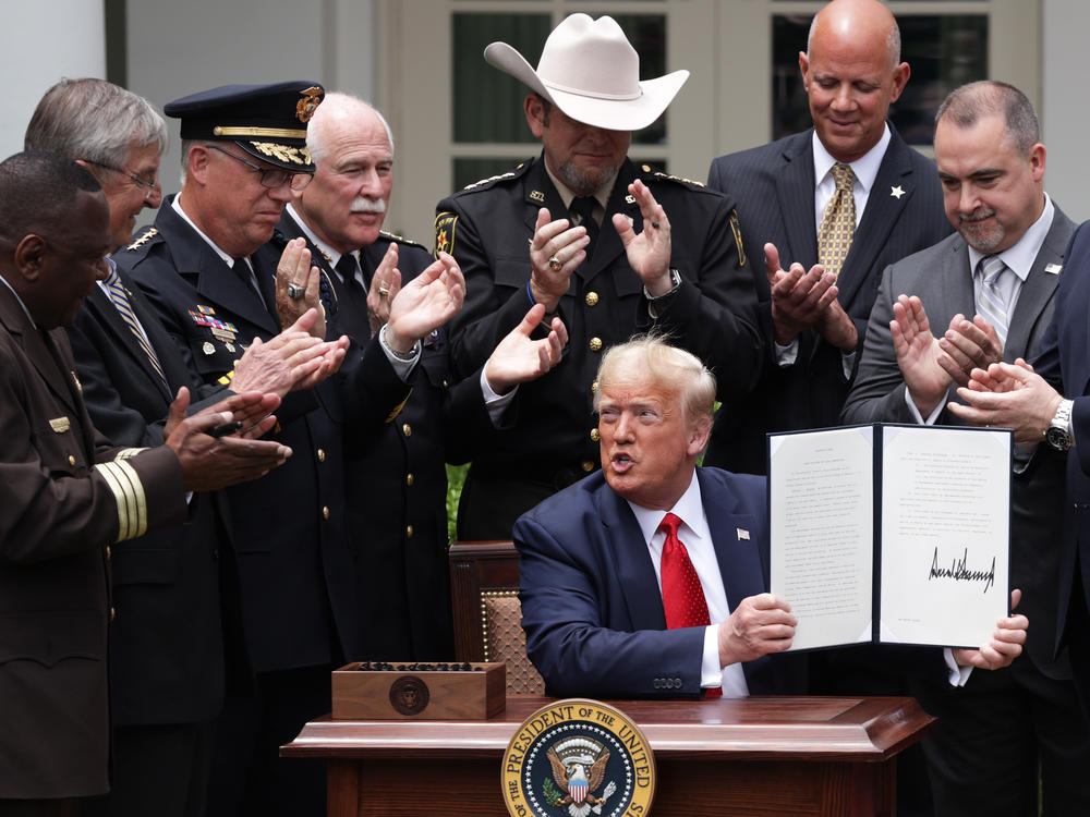 President Trump surrounded himself with supportive law enforcement officials, signing an executive order on reforms this summer after the killing of George Floyd at the hands of police.