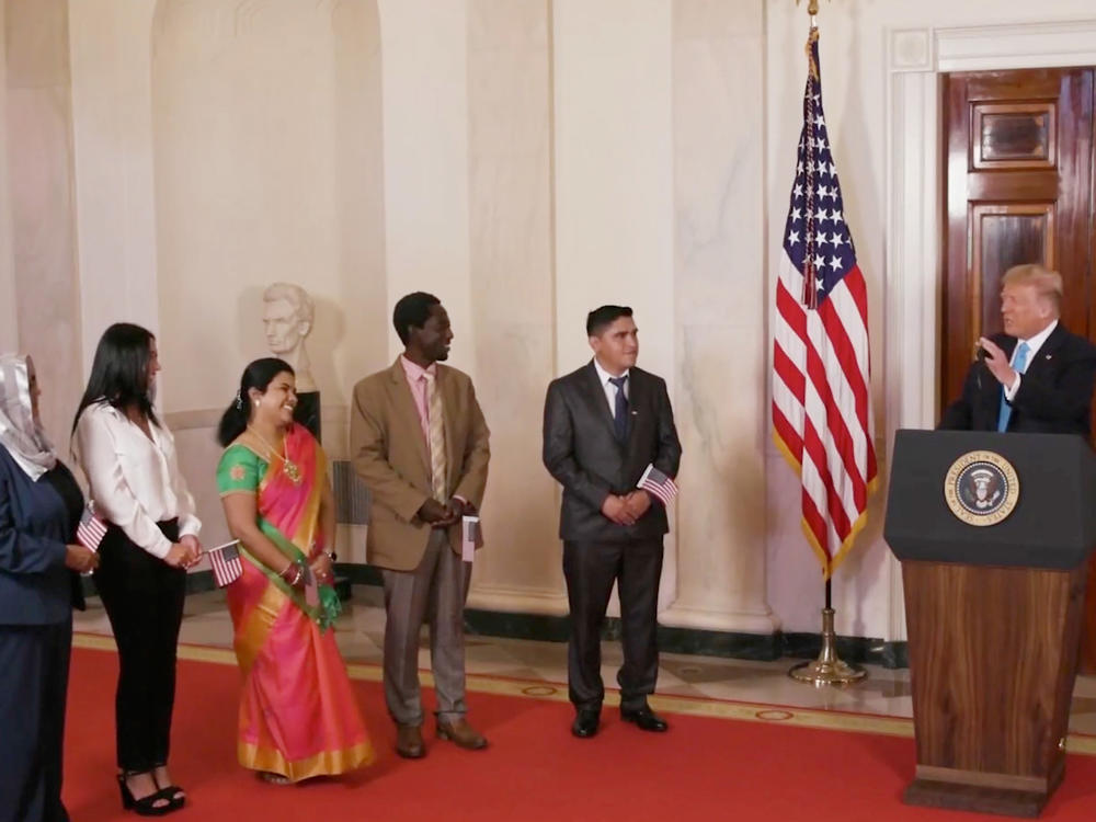President Trump hosts a naturalization ceremony for new citizens in a prerecorded video that was broadcast during the GOP's virtual convention on Tuesday. Trump and other members of his administration are facing criticism for using official resources for a political event.