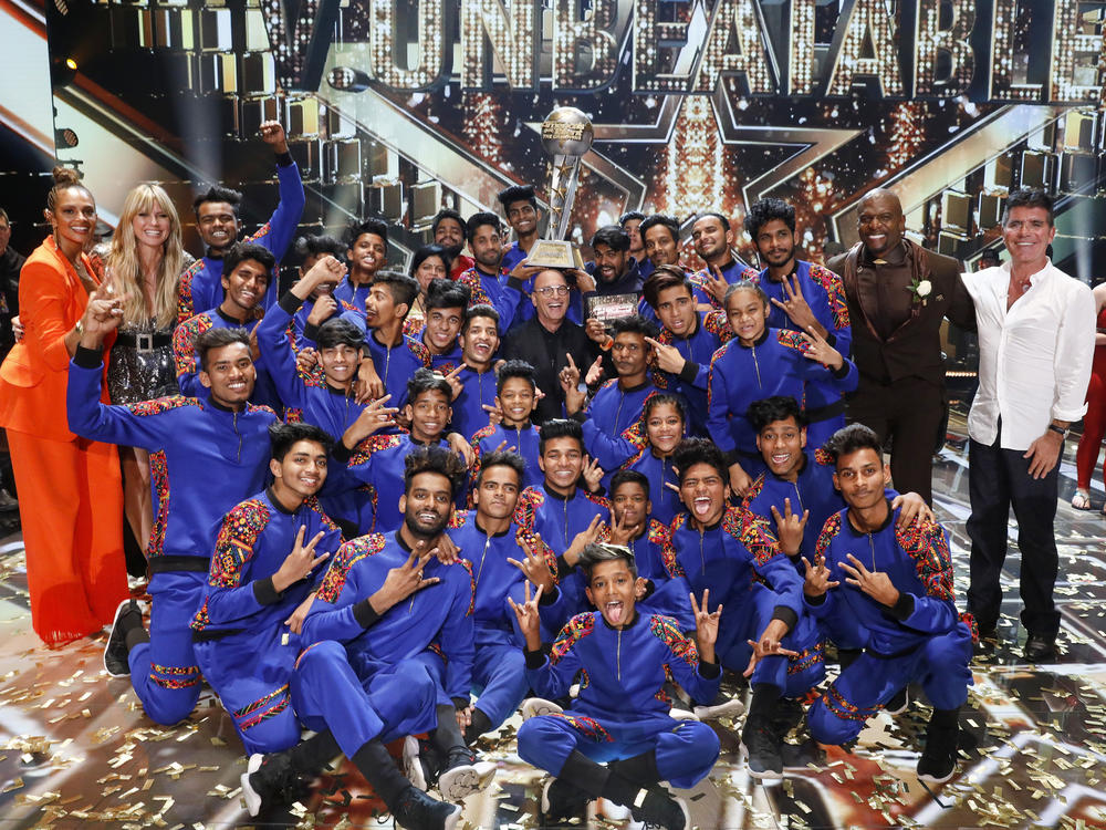 V Unbeatable, the dance troup from Mumbia that won the top prize on <em>America's Got Talent: The Champions</em> this year, are pictured with (left to right) Alesha Dixon, Heidi Klum, Howie Mandel, Terry Crews and Simon Cowell.
