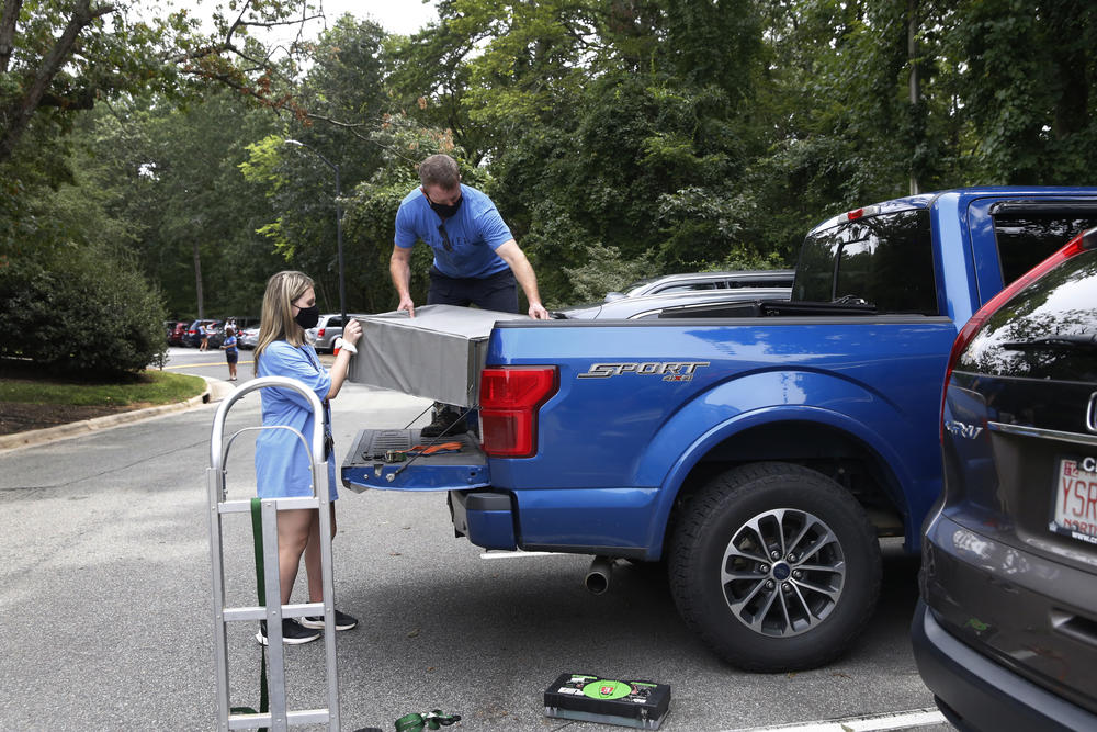 Freshman Cameron McClure moves out of her UNC dorm with help from her father, David McClure. 
