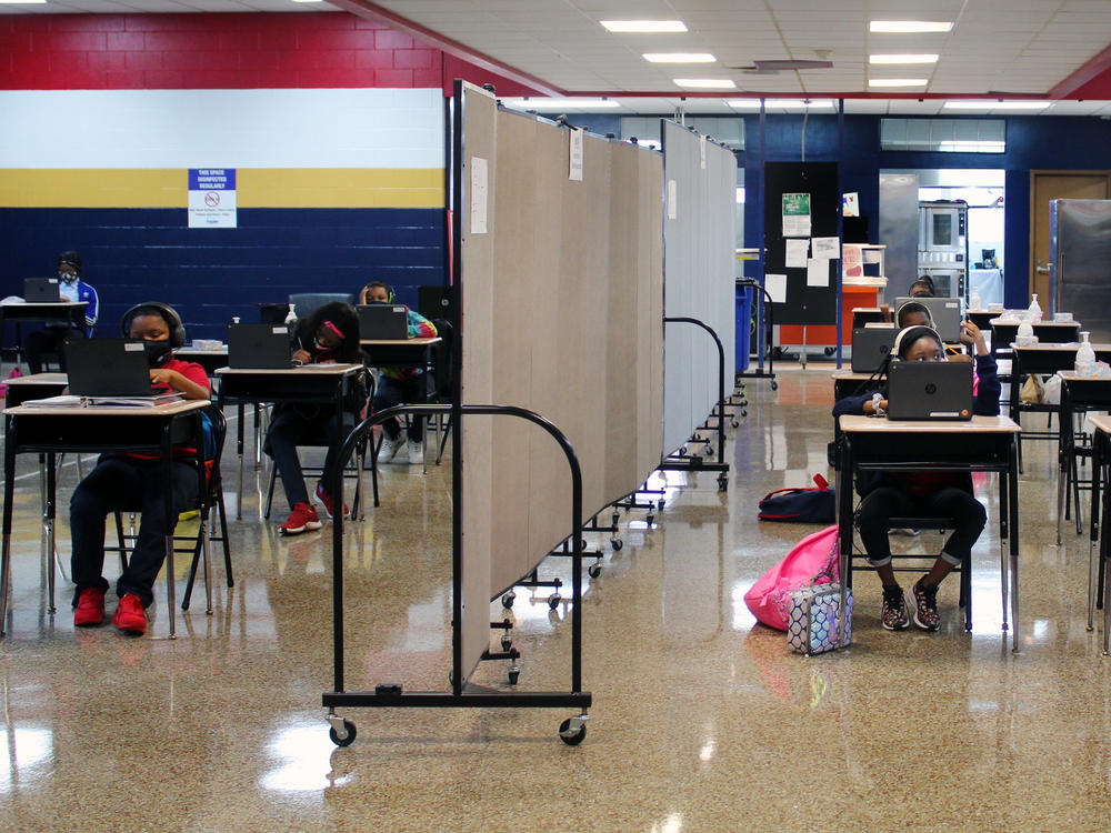 A flex wall separates two groups of students in the cafeteria at Dwight D. Eisenhower Charter School in New Orleans.