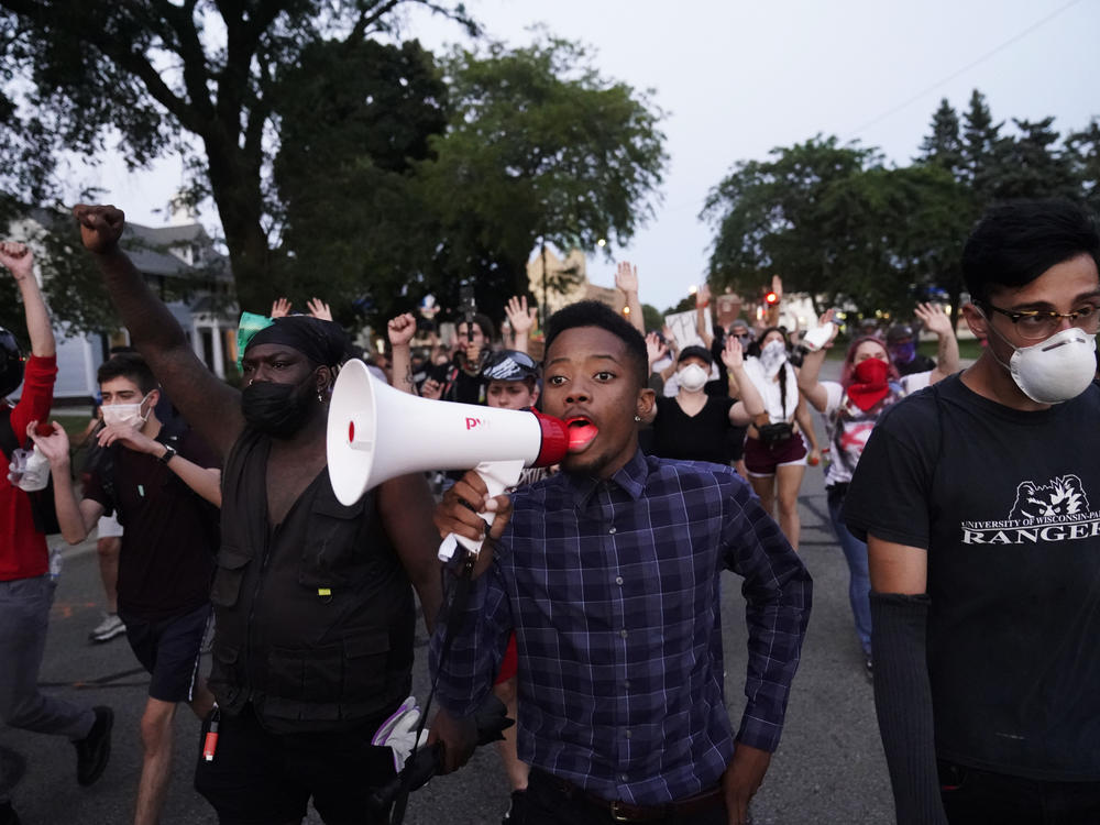 Protesters march Wednesday against the police shooting of Jacob Blake in Kenosha, Wis., over the weekend.
