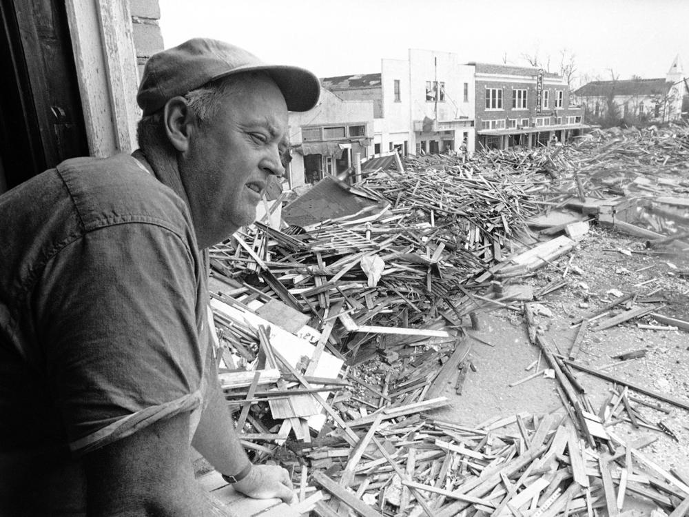 Parnell McKay, the civil defense director of Pass Christian, Miss., looks over the town's main business district on Aug. 23, 1969 after Hurricane Camille passed through.