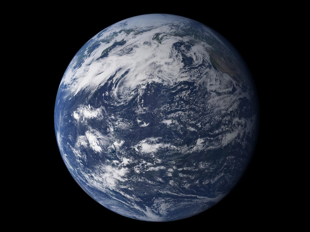 The Pacific Ocean from space. In both liquid and frozen form, water covers most of the Earth's surface, and there's been a debate among scientists about where all the water originated.