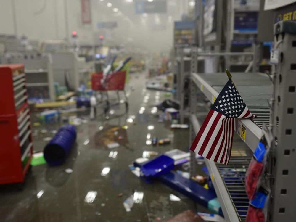A flag drapes across looted shelves in a hardware store during widespread unrest following the death of George Floyd on May 31, 2020 in Philadelphia, Penn.